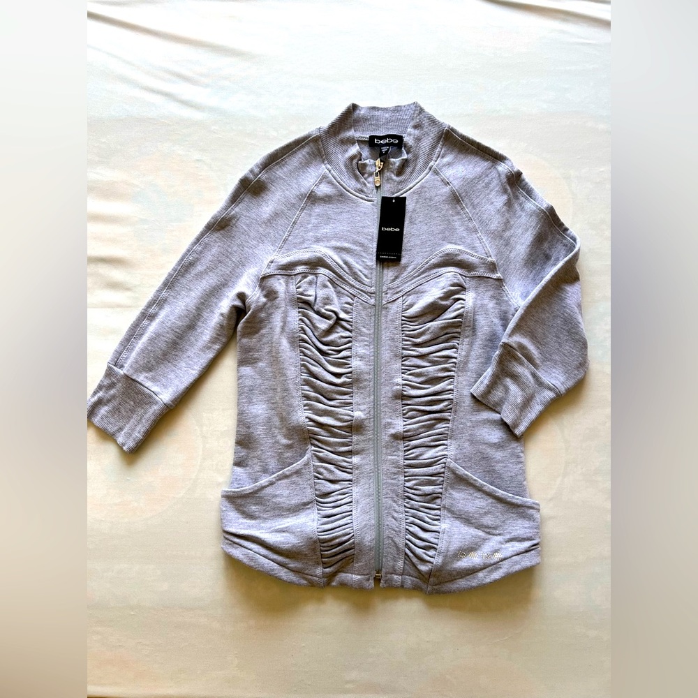 Bebe brand zip up sweatshirt with Gem Detailing!